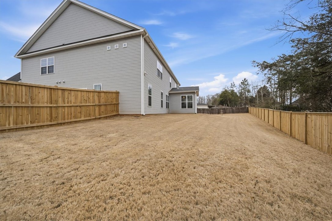 324 Crestgate Way Easley, SC 29642 - Photo 37 of 44 This spacious property features a durable vinyl exterior and a fully fenced private yard.