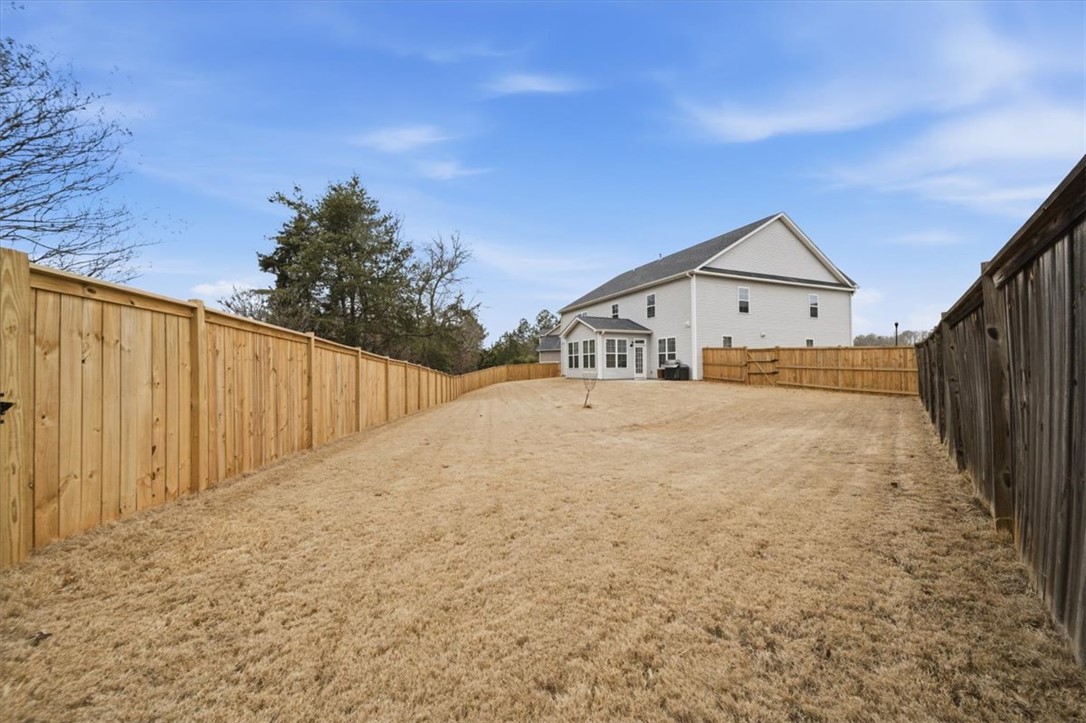 324 Crestgate Way Easley, SC 29642 - Photo 38 of 44 This expansive, private yard provides ample space for outdoor activities and future landscaping dreams.