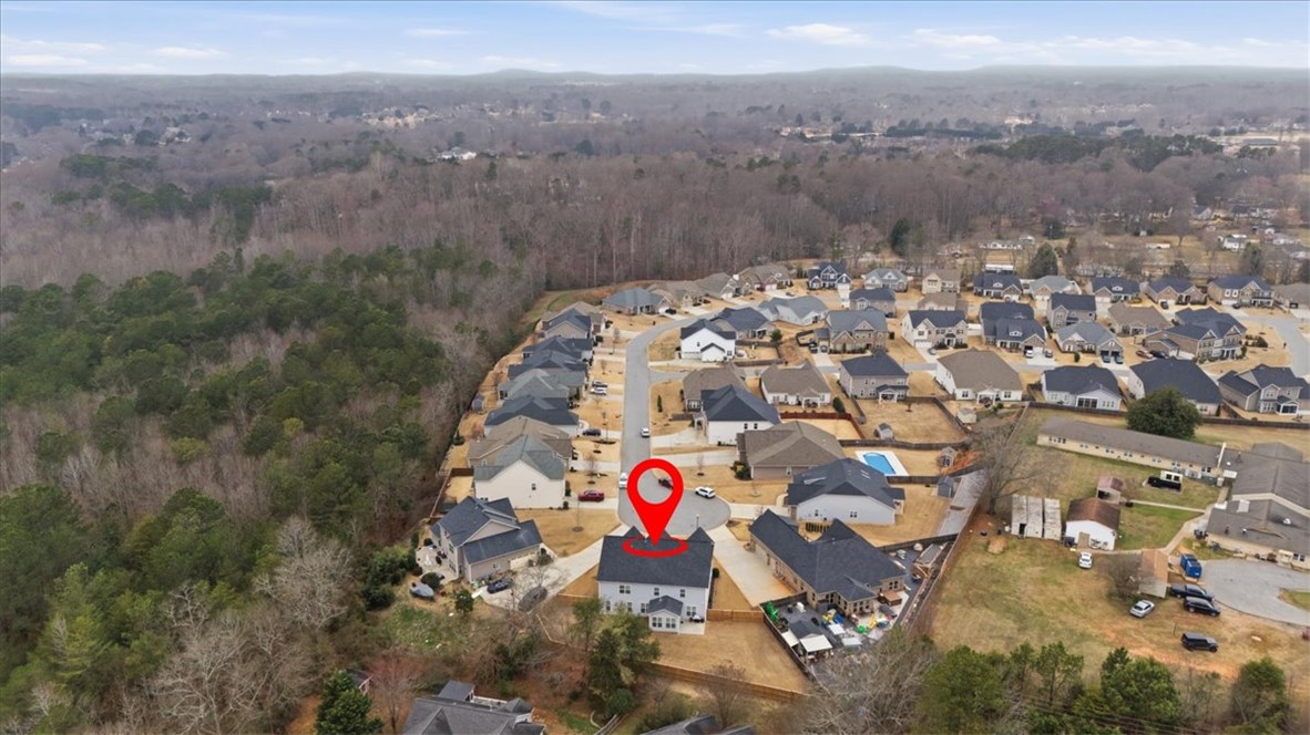 324 Crestgate Way Easley, SC 29642 - Photo 39 of 44 An aerial view showcases a residential community nestled beside a lush, wooded landscape.