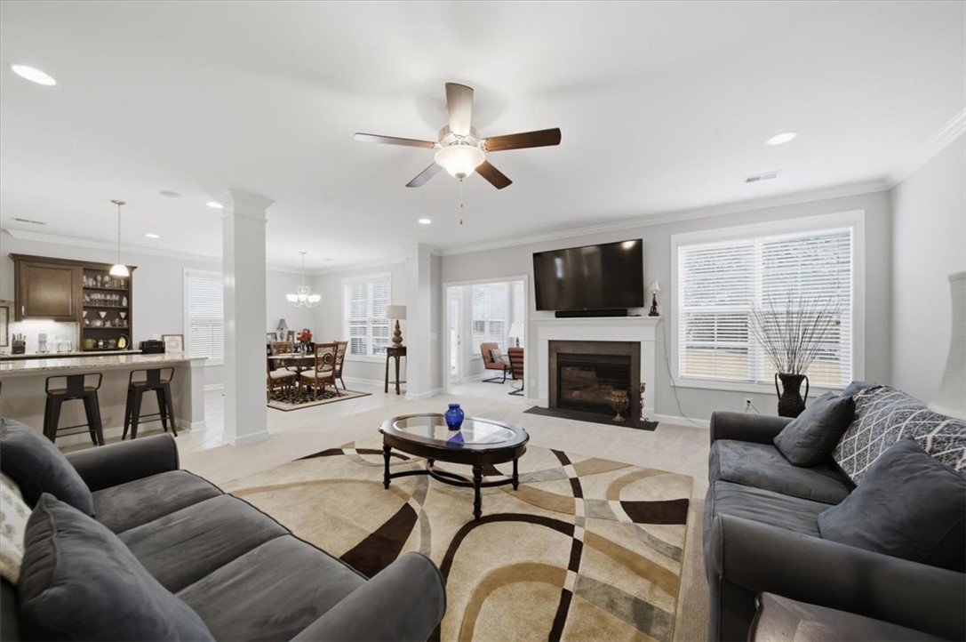 324 Crestgate Way Easley, SC 29642 - Photo 3 of 44 This inviting living space features an open concept layout, perfect for gatherings.