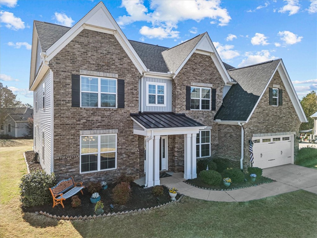 324 Crestgate Way Easley, SC 29642 - Photo 41 of 44 This residence showcases elegant brick and siding, complemented by a charming covered entryway.