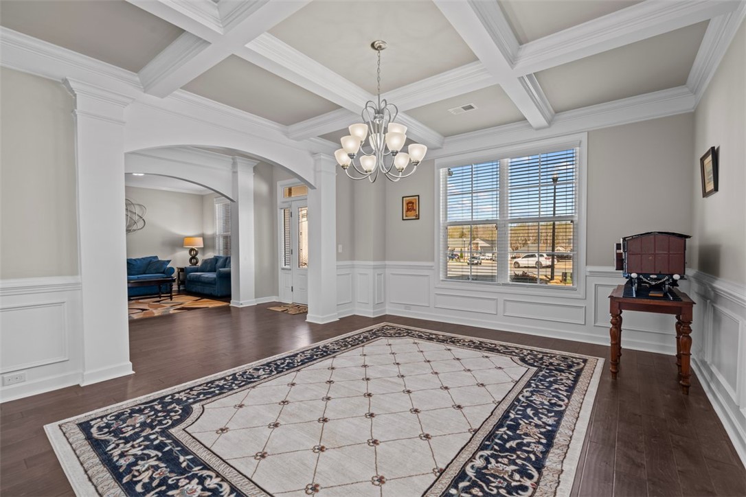 324 Crestgate Way Easley, SC 29642 - Photo 6 of 44 Elegant living area showcasing classic design with coffered ceilings and hardwood floors.