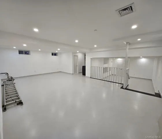 an empty room with wooden floor