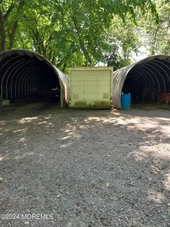 a view of house with backyard