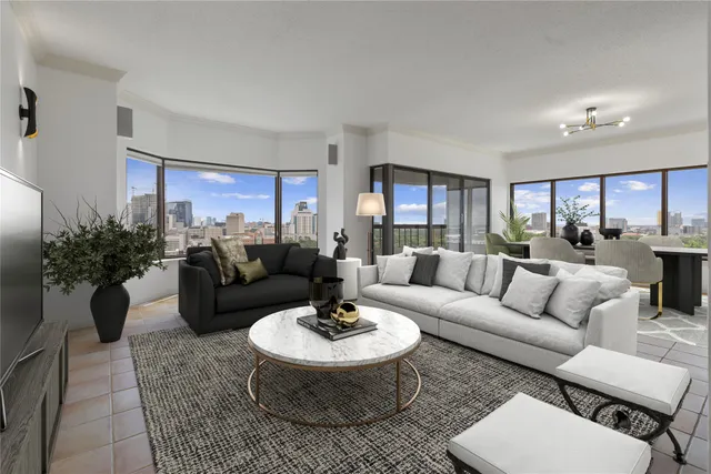 a living room with furniture and a table