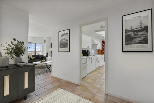 a kitchen with stainless steel appliances kitchen island granite countertop a refrigerator and a stove