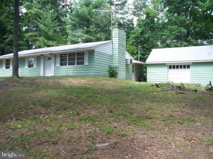 2818 Tabor Road Berkeley Springs, WV 25411 - Photo 2 of 21 a view of a house with a yard