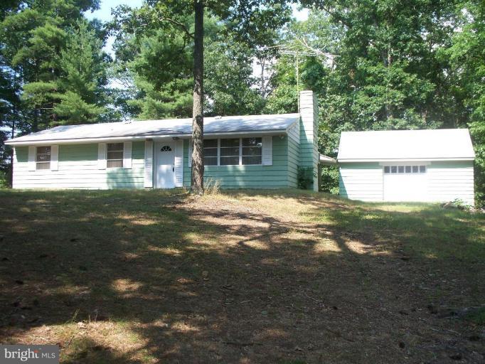 2818 Tabor Road Berkeley Springs, WV 25411 - Photo 11 of 21 a view of a house with a yard