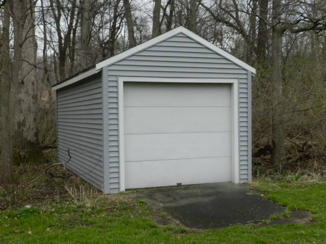 7014 East McCormick Road Stillman Valley, IL 61084 - Photo 11 of 13 a front view of a house with a yard