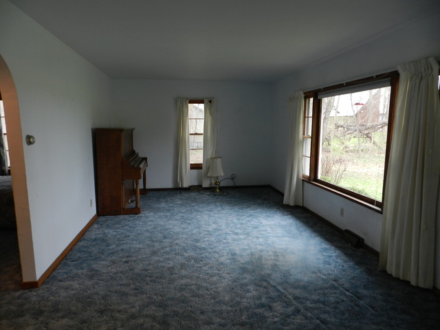 7014 East McCormick Road Stillman Valley, IL 61084 - Photo 4 of 13 an empty room with windows