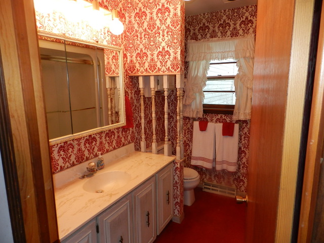7014 East McCormick Road Stillman Valley, IL 61084 - Photo 9 of 13 a bathroom with a granite countertop sink and a mirror