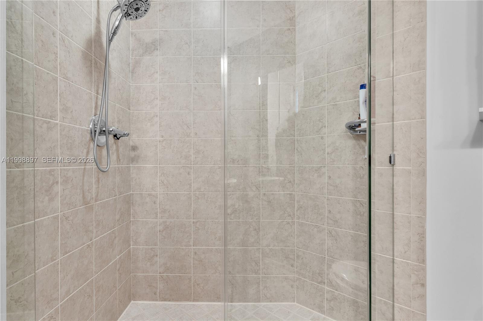 60 Southwest 13th Street, Unit 4818 Miami, FL 33130 - Photo 16 of 19 a bathroom with a shower