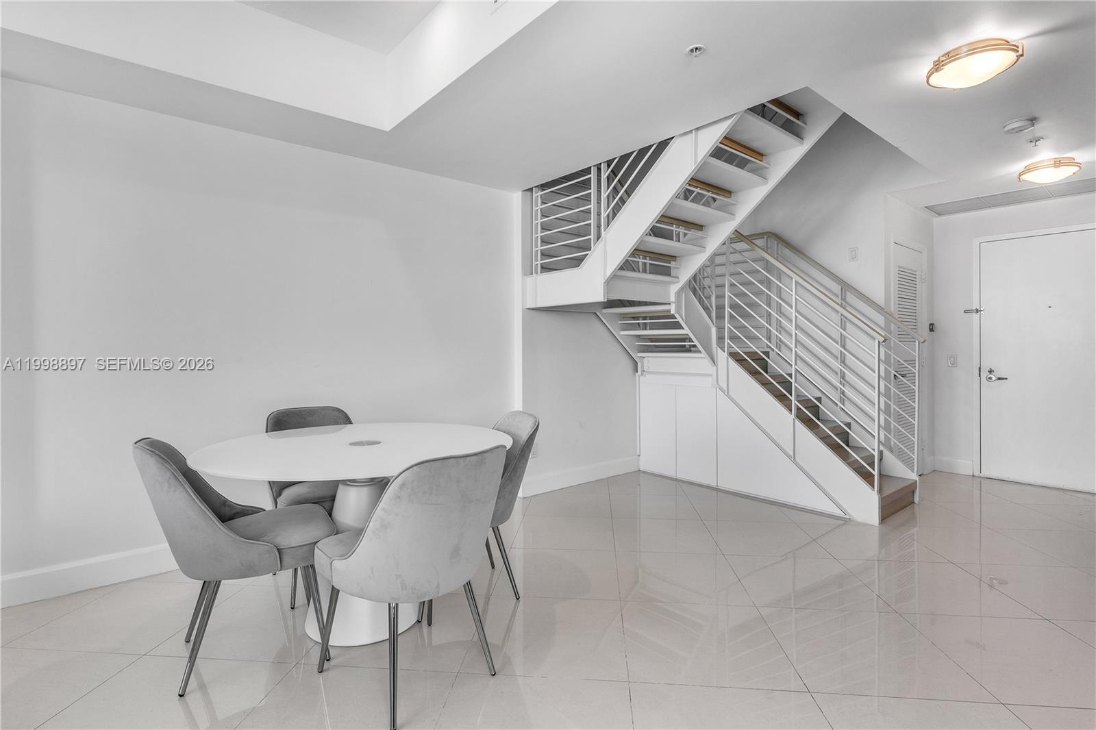 60 Southwest 13th Street, Unit 4818 Miami, FL 33130 - Photo 9 of 19 a view of a hallway with seating area