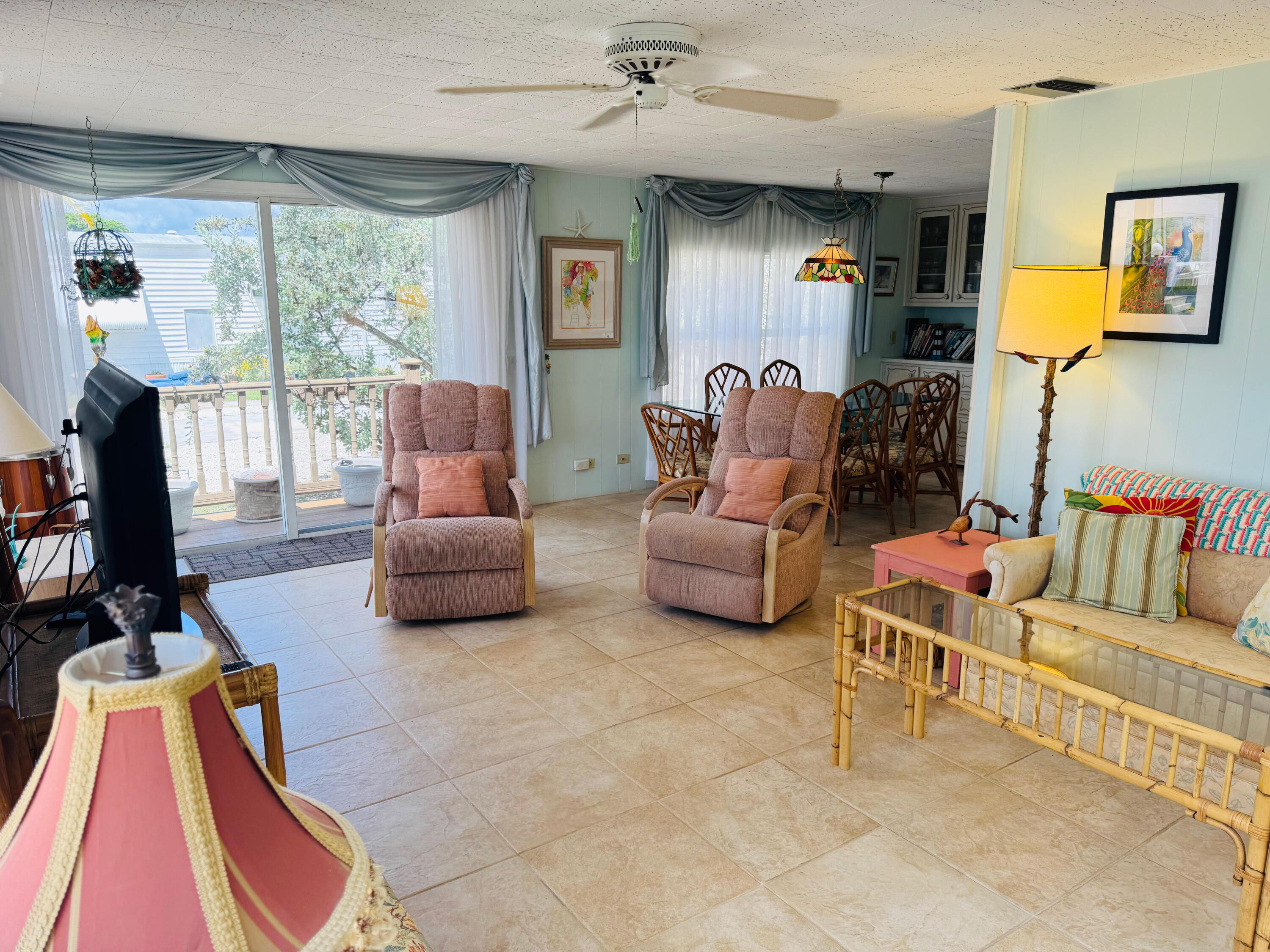 205 South Ibis Drive, Unit R Briny Breezes, FL 33435 - Photo 11 of 38 a living room with furniture and a flat screen tv