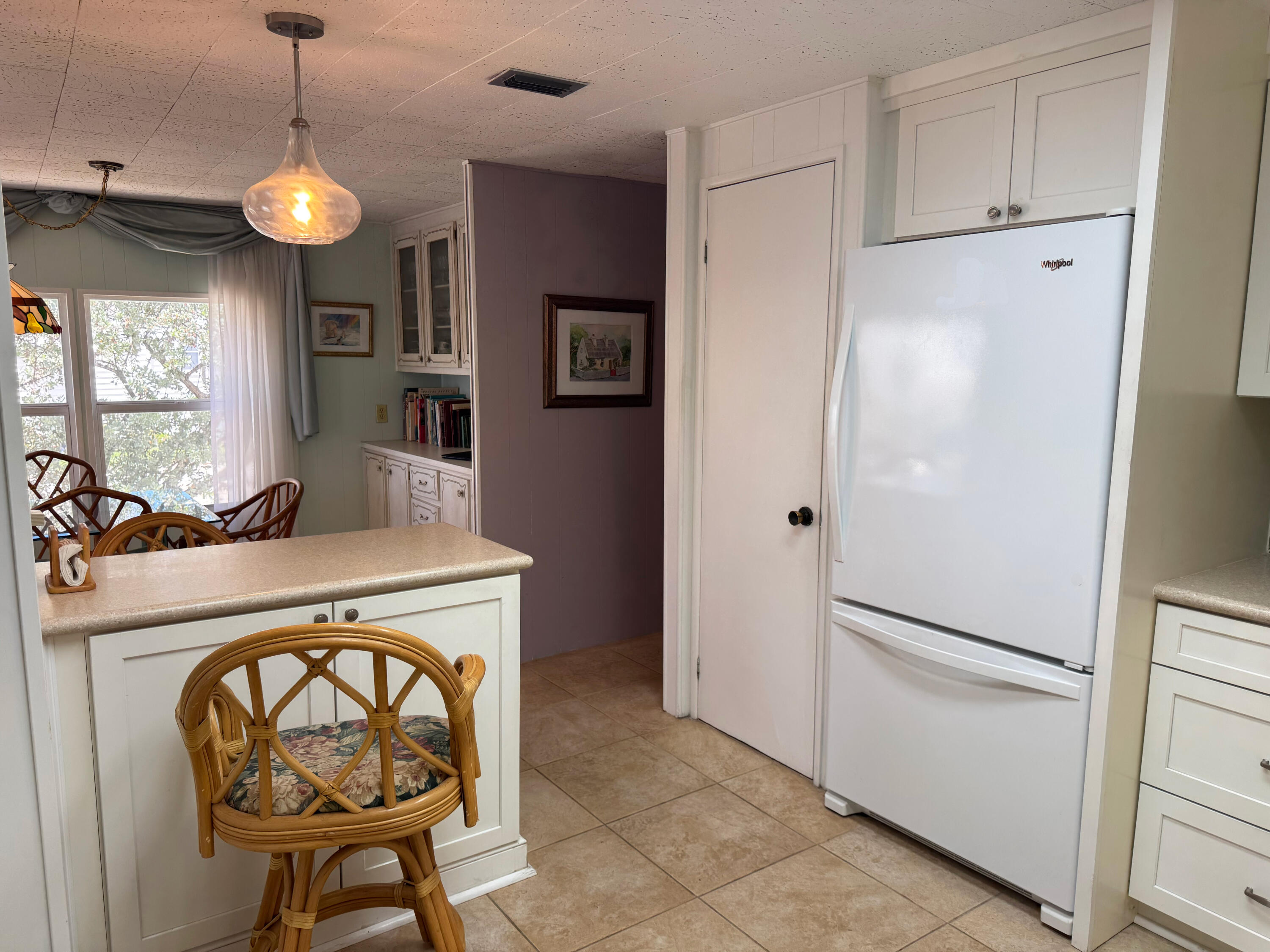 205 South Ibis Drive, Unit R Briny Breezes, FL 33435 - Photo 20 of 38 a kitchen with refrigerator and window