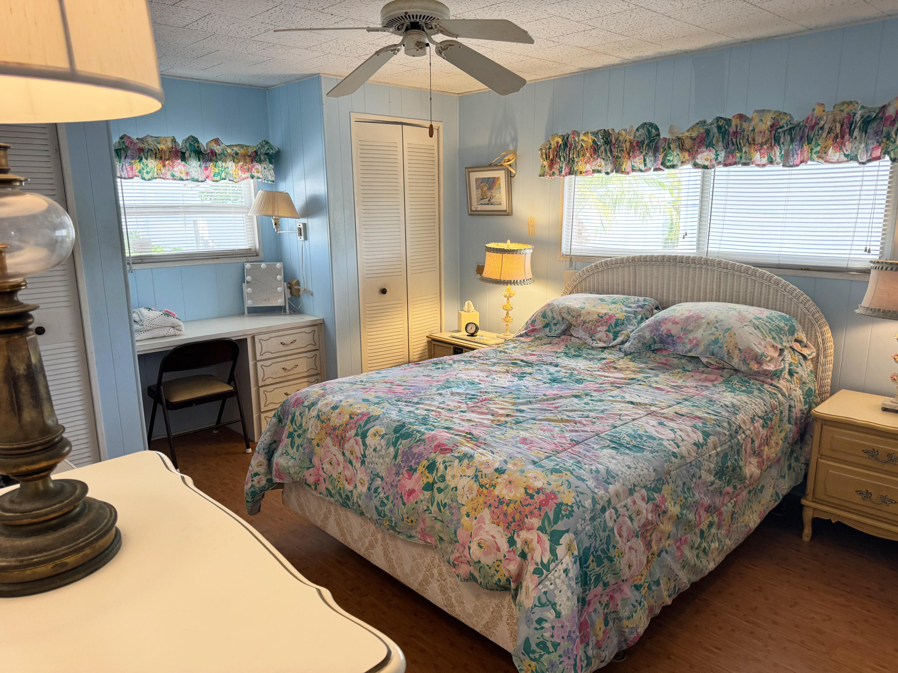 205 South Ibis Drive, Unit R Briny Breezes, FL 33435 - Photo 21 of 38 a bedroom with a bed and a chandelier