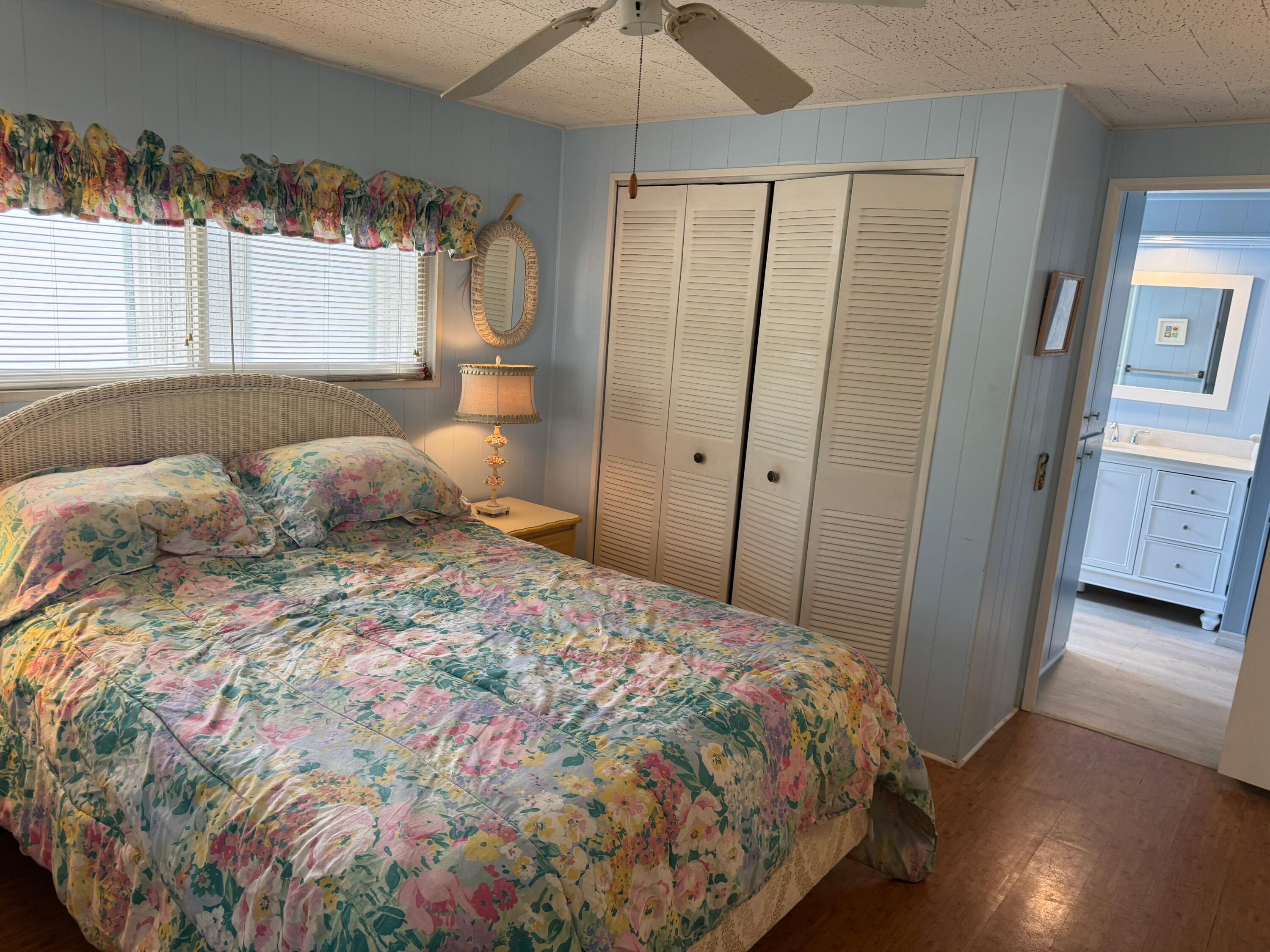 205 South Ibis Drive, Unit R Briny Breezes, FL 33435 - Photo 22 of 38 a bedroom with a large bed and a chandelier