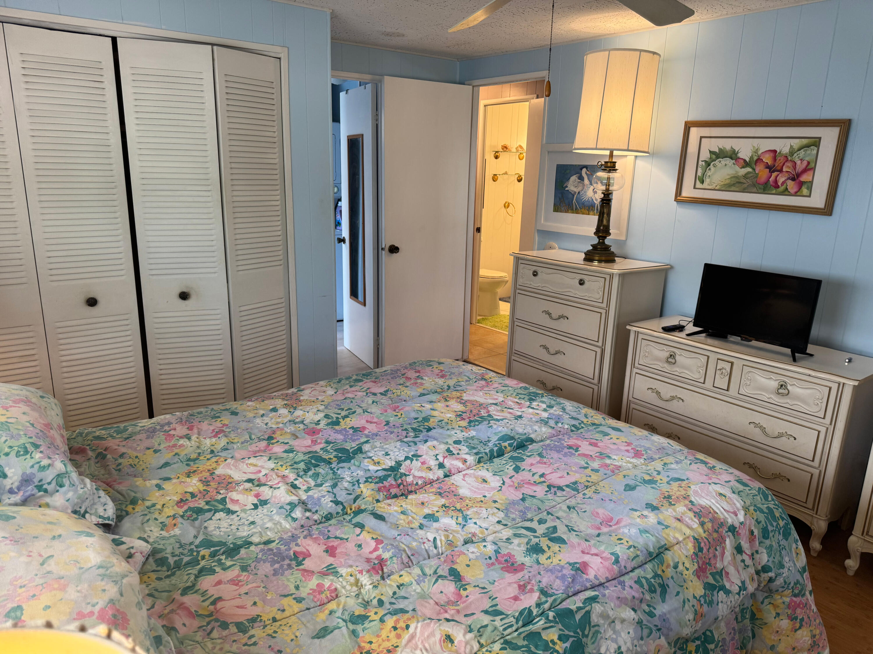 205 South Ibis Drive, Unit R Briny Breezes, FL 33435 - Photo 23 of 38 a bedroom with a bed and a television