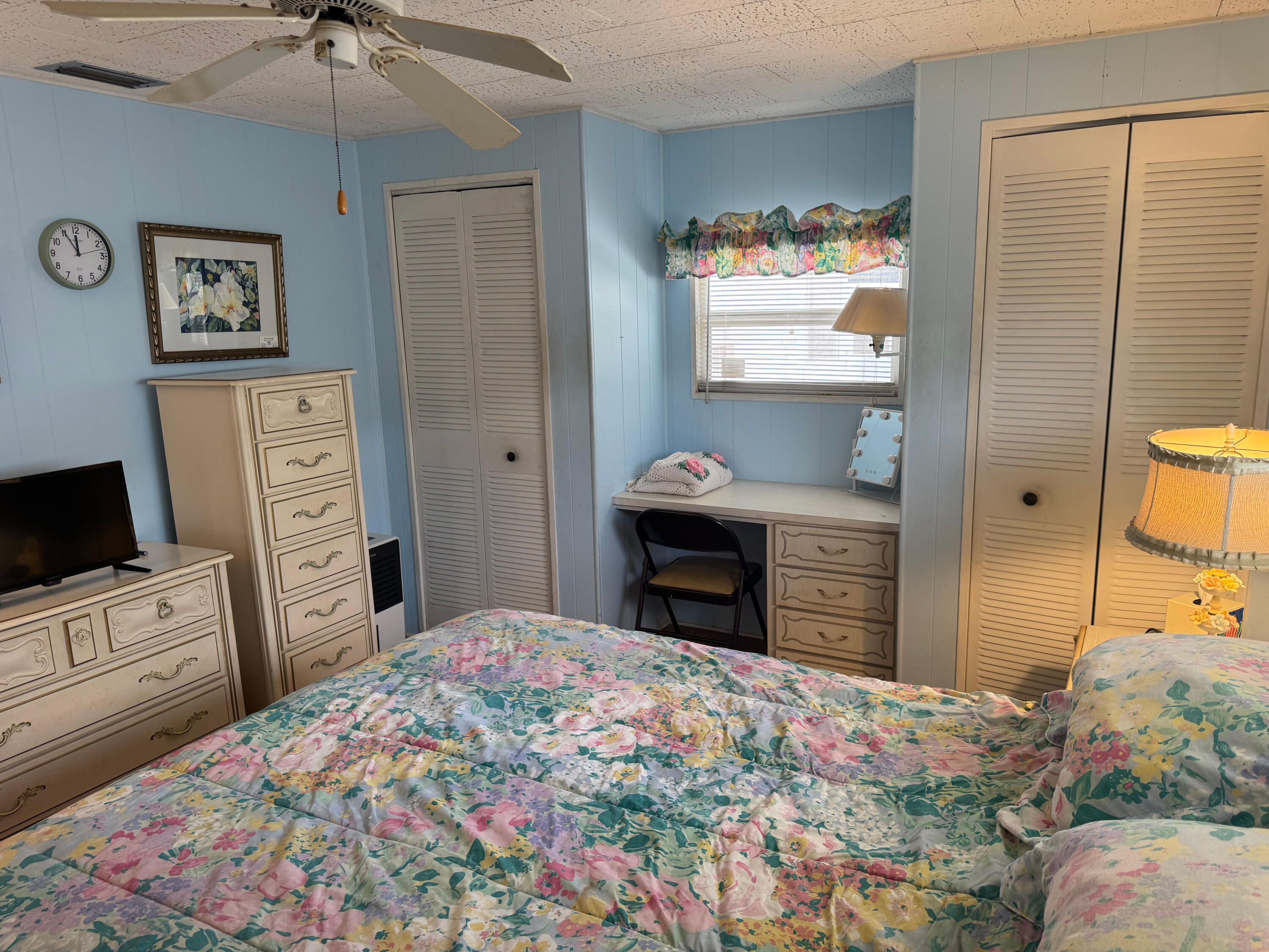 205 South Ibis Drive, Unit R Briny Breezes, FL 33435 - Photo 24 of 38 a bedroom with a bed and a television