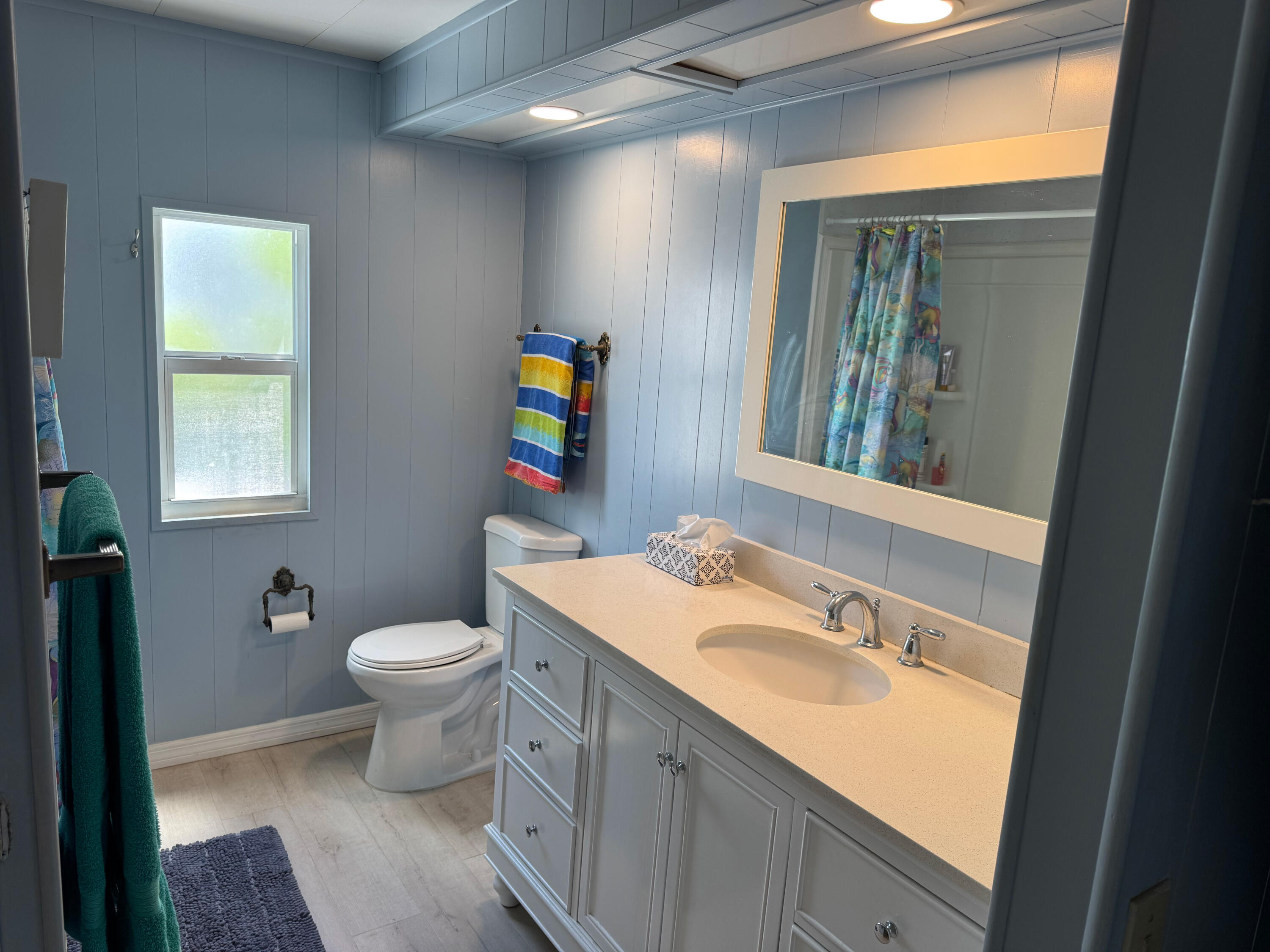 205 South Ibis Drive, Unit R Briny Breezes, FL 33435 - Photo 25 of 38 a bathroom with a sink toilet and mirror