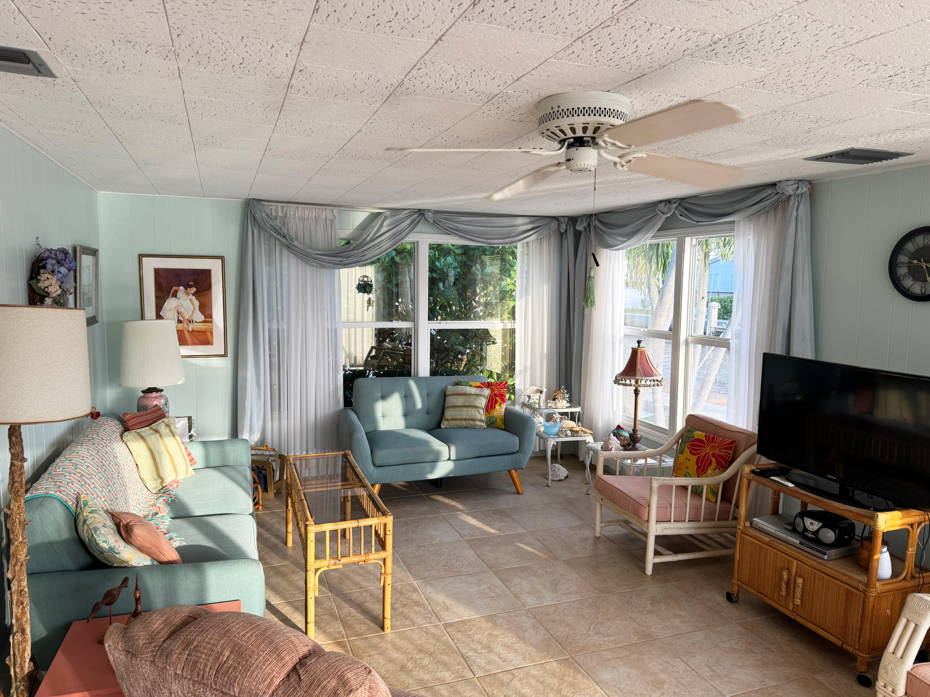 205 South Ibis Drive, Unit R Briny Breezes, FL 33435 - Photo 38 of 38 a living room with furniture and a flat screen tv