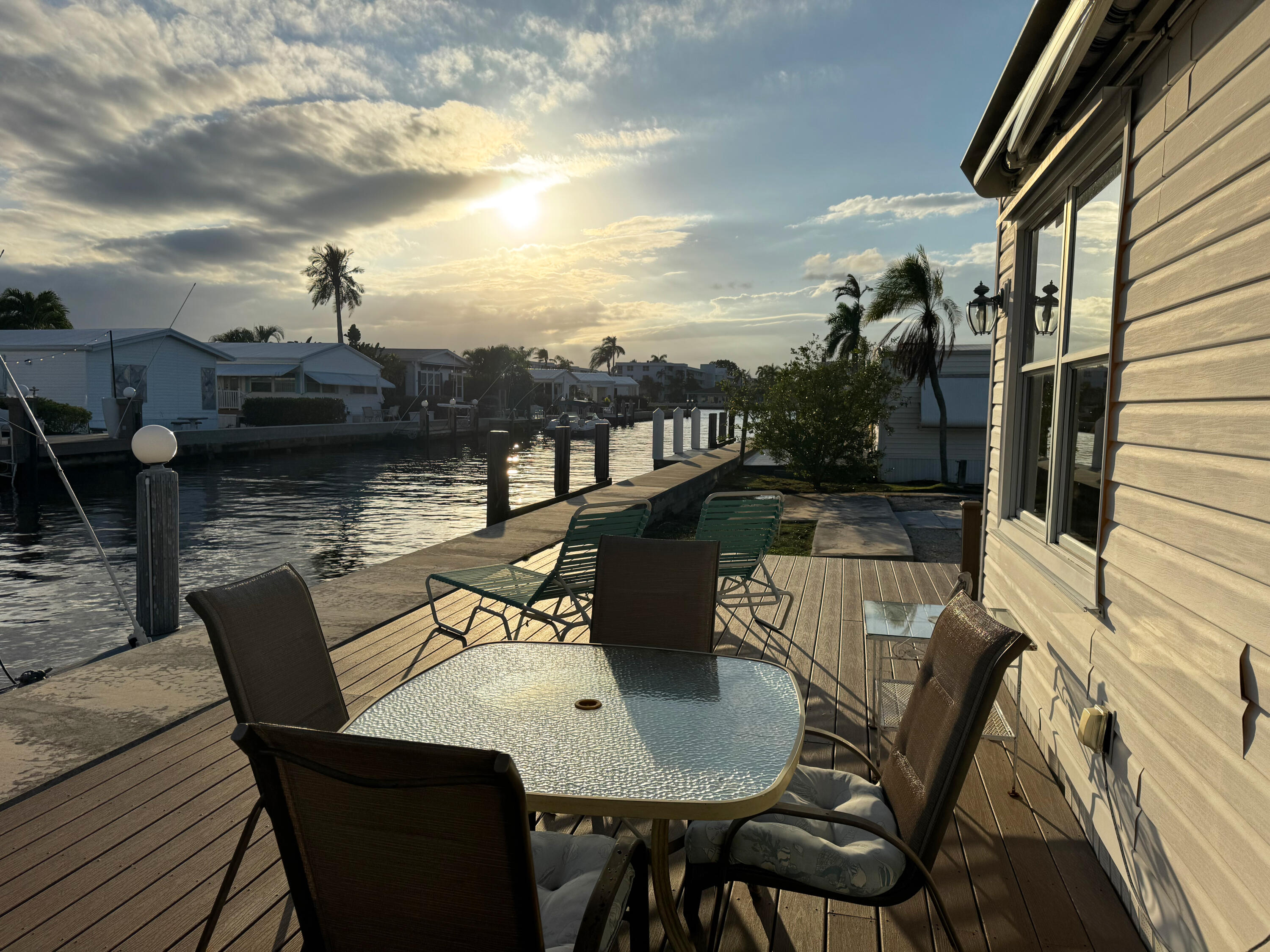 205 South Ibis Drive, Unit R Briny Breezes, FL 33435 - Photo 5 of 38 a view of a chairs and table on the deck