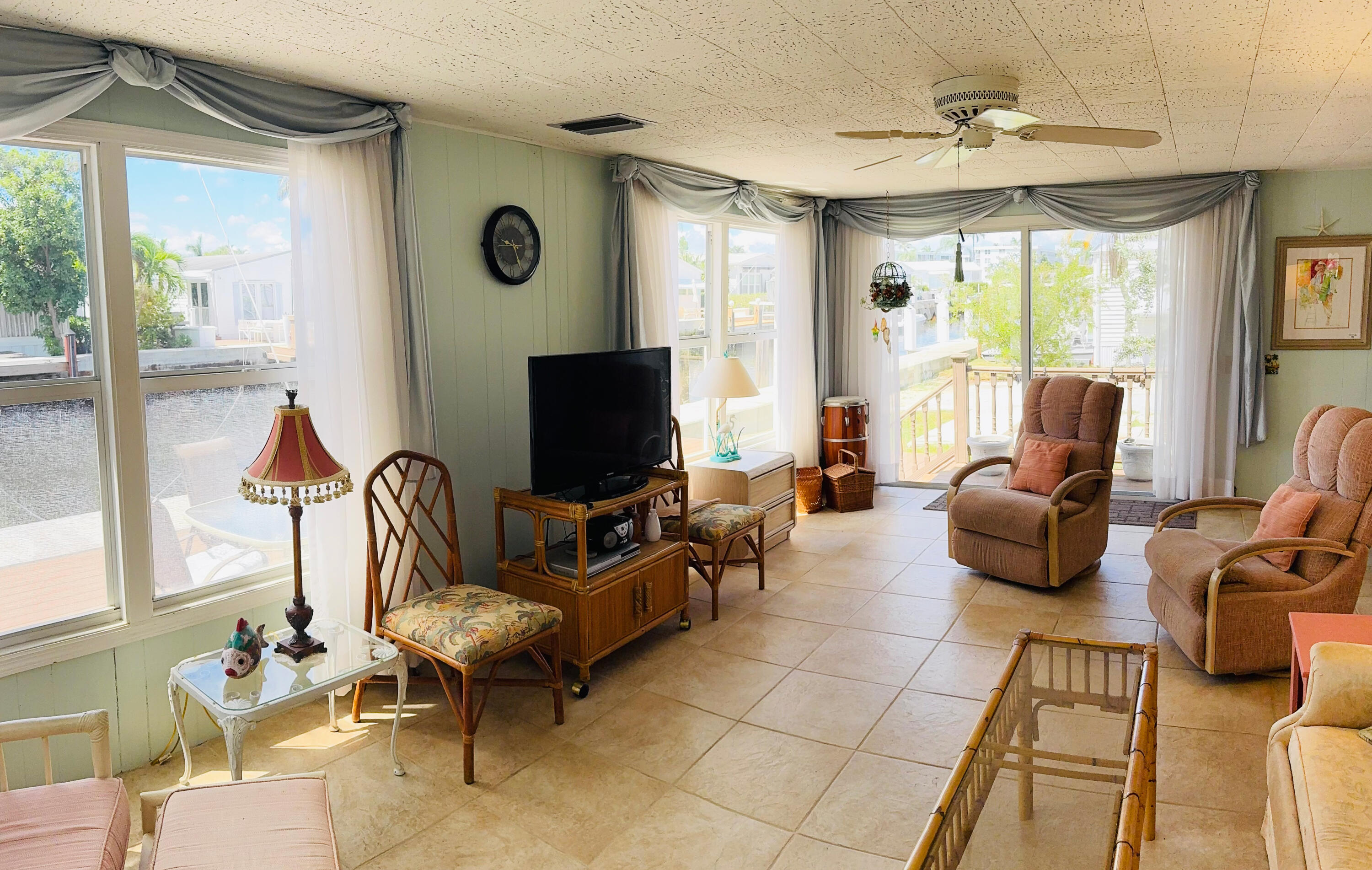 205 South Ibis Drive, Unit R Briny Breezes, FL 33435 - Photo 9 of 38 a living room with furniture and a flat screen tv