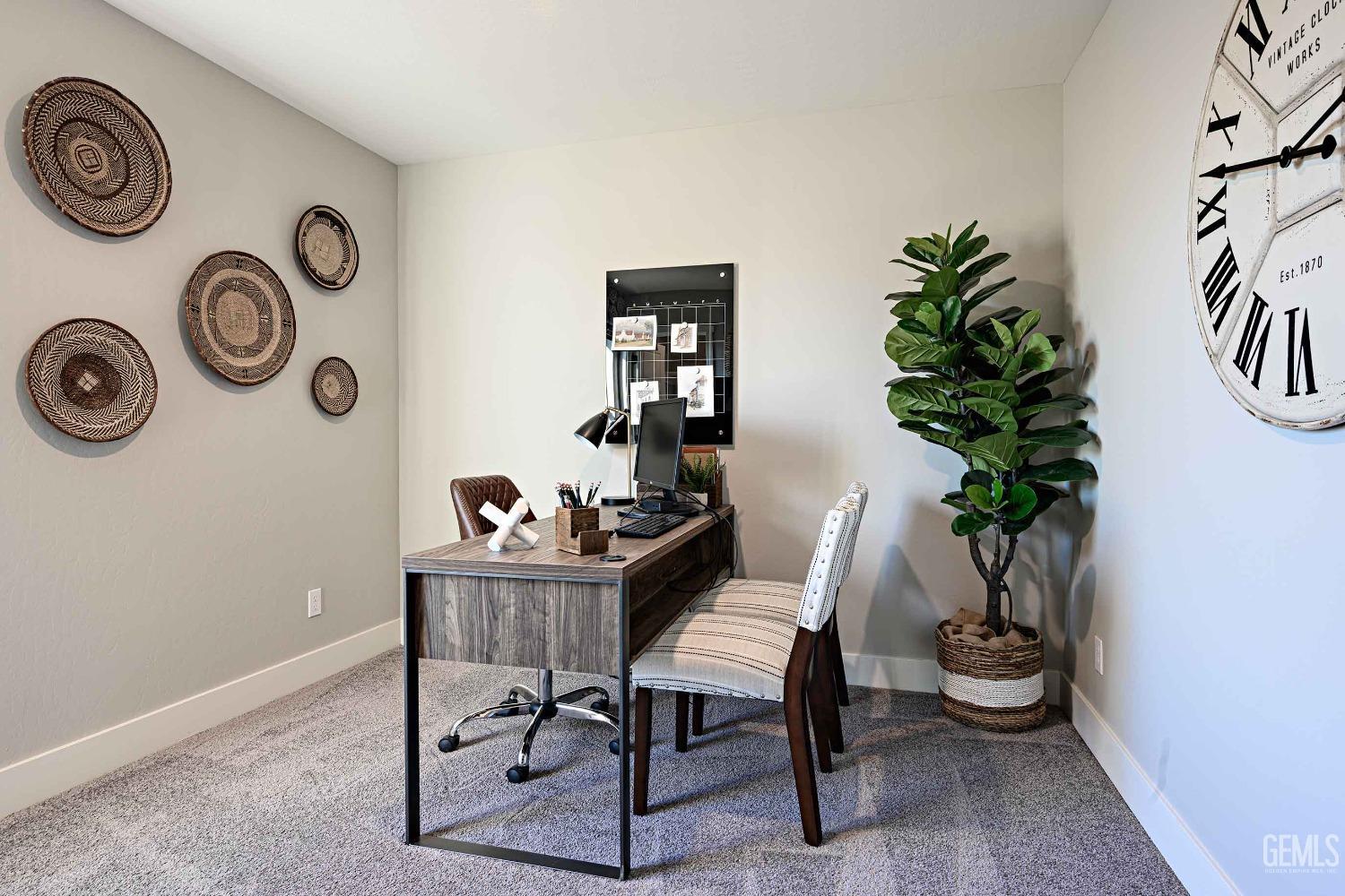 Undisclosed Address Bakersfield, CA 93313 - Photo 23 of 27 a table with a potted plant and a wooden floor