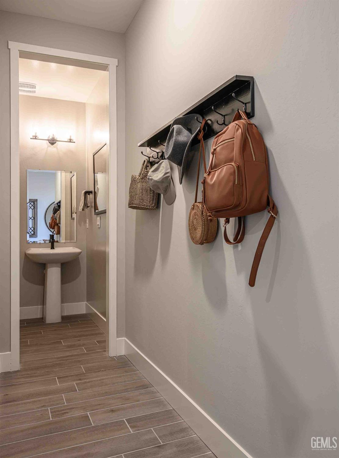 Undisclosed Address Bakersfield, CA 93313 - Photo 26 of 27 a walk in closet and view of bathroom with sink