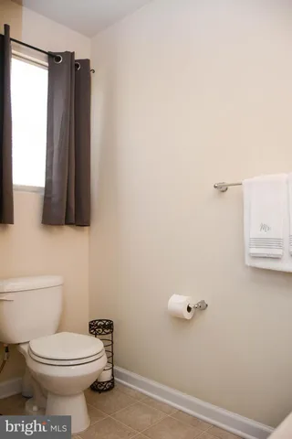 a bathroom with a glass door shower