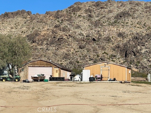 31163 Villa Nova Road Lucerne Valley, CA 92356 - Photo 12 of 25 a view of large house with a outdoor space