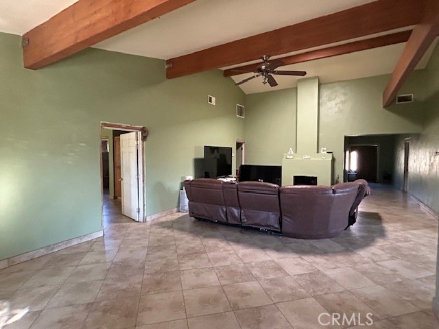 31163 Villa Nova Road Lucerne Valley, CA 92356 - Photo 2 of 25 a living room with furniture and a flat screen tv