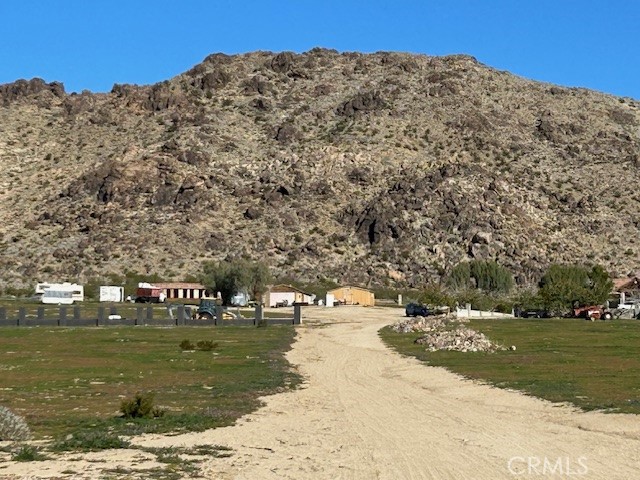 31163 Villa Nova Road Lucerne Valley, CA 92356 - Photo 21 of 25 a view of a building with a yard