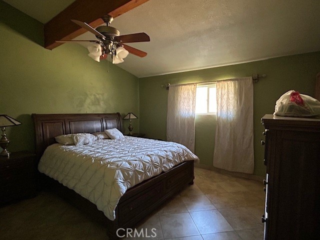 31163 Villa Nova Road Lucerne Valley, CA 92356 - Photo 8 of 25 a bedroom with a bed and a chandelier
