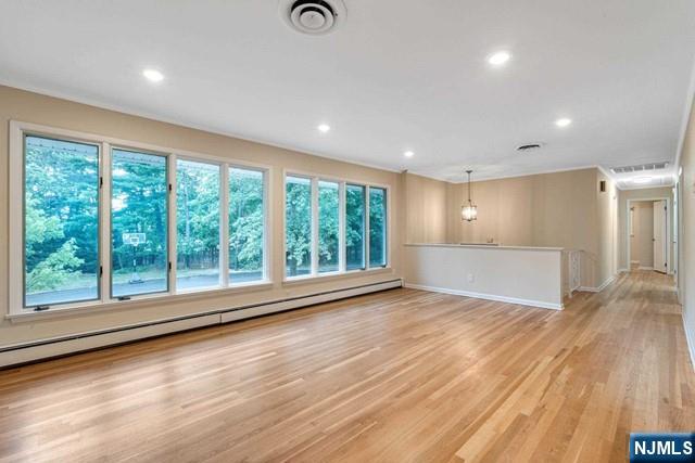 32 Rock Road Englewood Cliffs, NJ 07632 - Photo 13 of 30 a view of empty room with wooden floor and fan