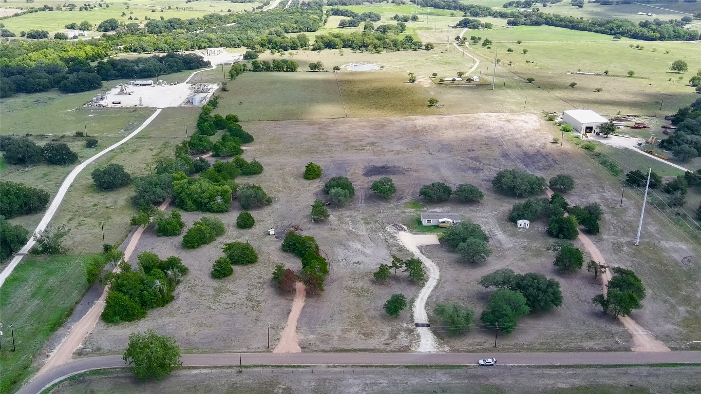 989 East Old Hallettsville Road Flatonia, TX 78941 - Photo 17 of 19 an aerial view of ocean and residential houses with outdoor space