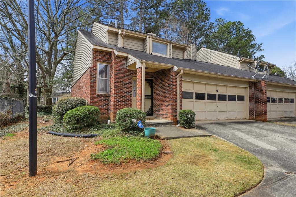 9 Belmonte Court Southwest Atlanta, GA 30311 - Photo 1 of 13 front view of a house with a yard