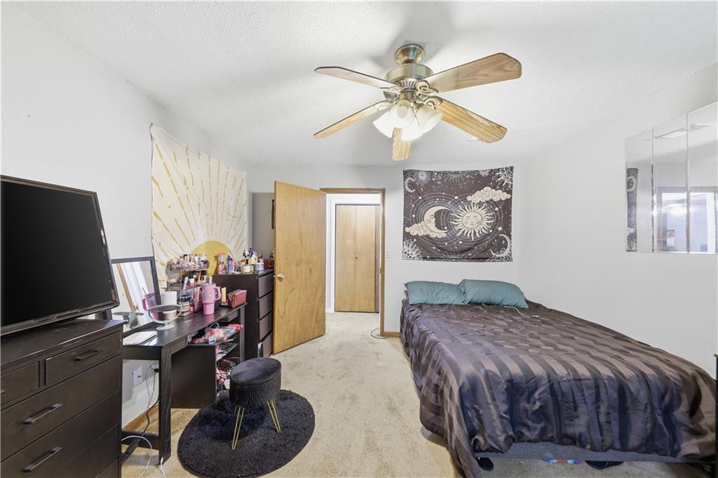9 Belmonte Court Southwest Atlanta, GA 30311 - Photo 10 of 13 a bedroom with a bed and a flat screen tv