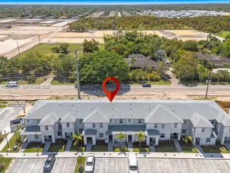 an aerial view of residential houses and outdoor space