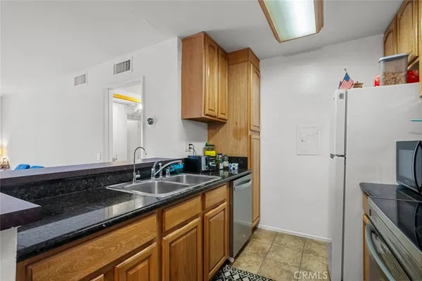 $389,999 | 23515 Lyons Avenue, Unit 210, Valencia, CA 91355
