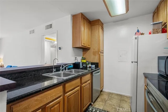 $389,999 | 23515 Lyons Avenue, Unit 210, Valencia, CA 91355