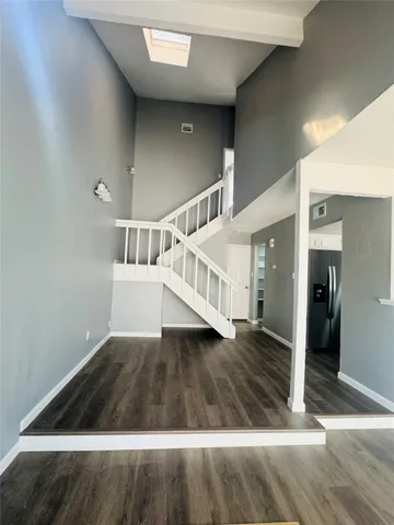 a view of entryway with wooden floor
