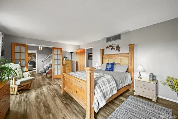 a bedroom with a bed and a fireplace
