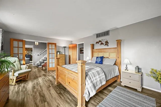 a bedroom with a bed and a fireplace