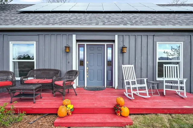 a backyard of a house with outdoor seating