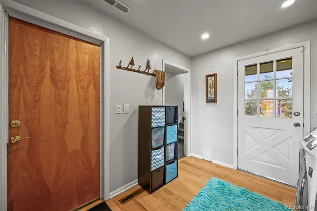 a bathroom with a toilet a sink and a mirror
