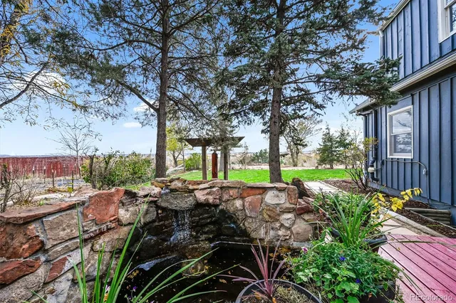 a view of yard with patio