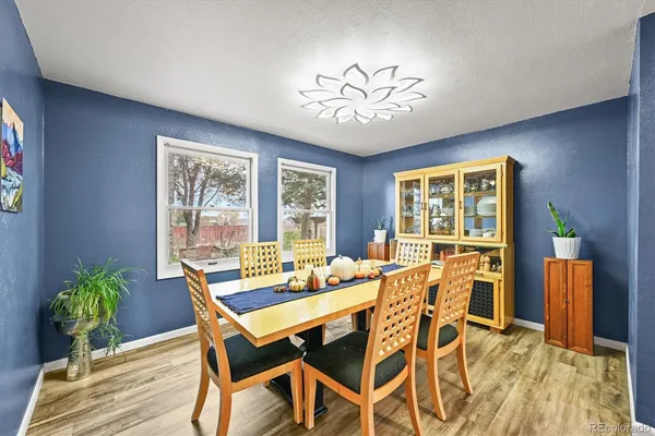 a view of a dining room with furniture window and wooden floor