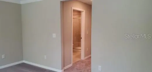 a view of a bathroom from a corridor