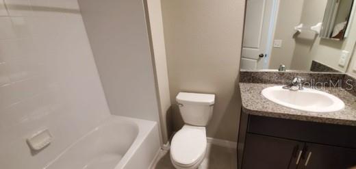 11859 Dumaine Valley Road Riverview, FL 33579 - Photo 14 of 19 a white toilet sitting next to a bathroom sink